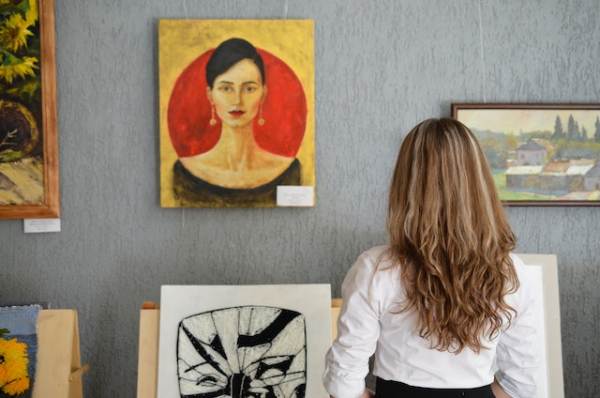 Art Galleries and Studio: Visitors viewing artworks in a contemporary art gallery and studio.