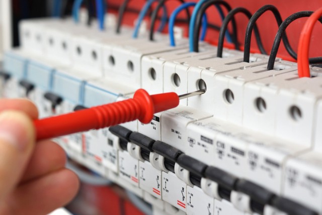 Electrical Contractor: Electrical contractors working on a residential electrical installation.